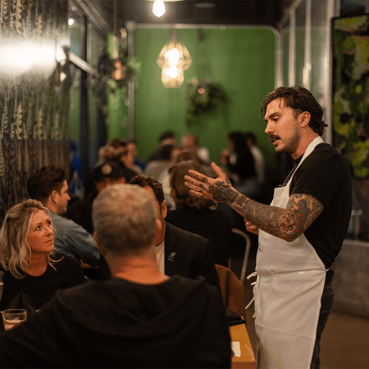 chef matt explaining a dish at a chef's table event at vice & virtue brewing kelowna