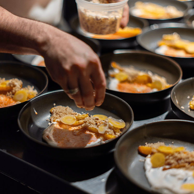 preparing dishes for chef's table at vice & virtue brewing kelowna
